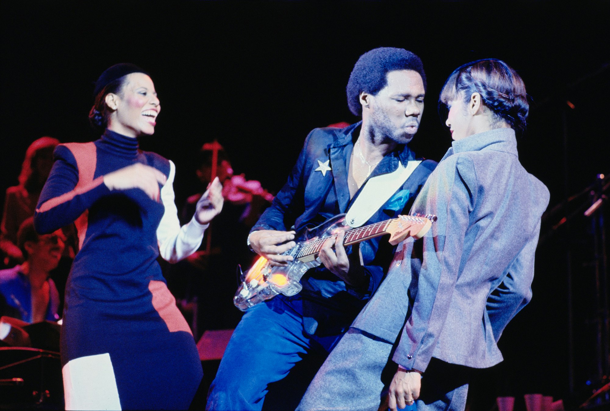 Alfa Anderson, Nile Rodgers, and Luci Martin onstage in London, October 1979. Photo by Gus Stewart/Getty Images.